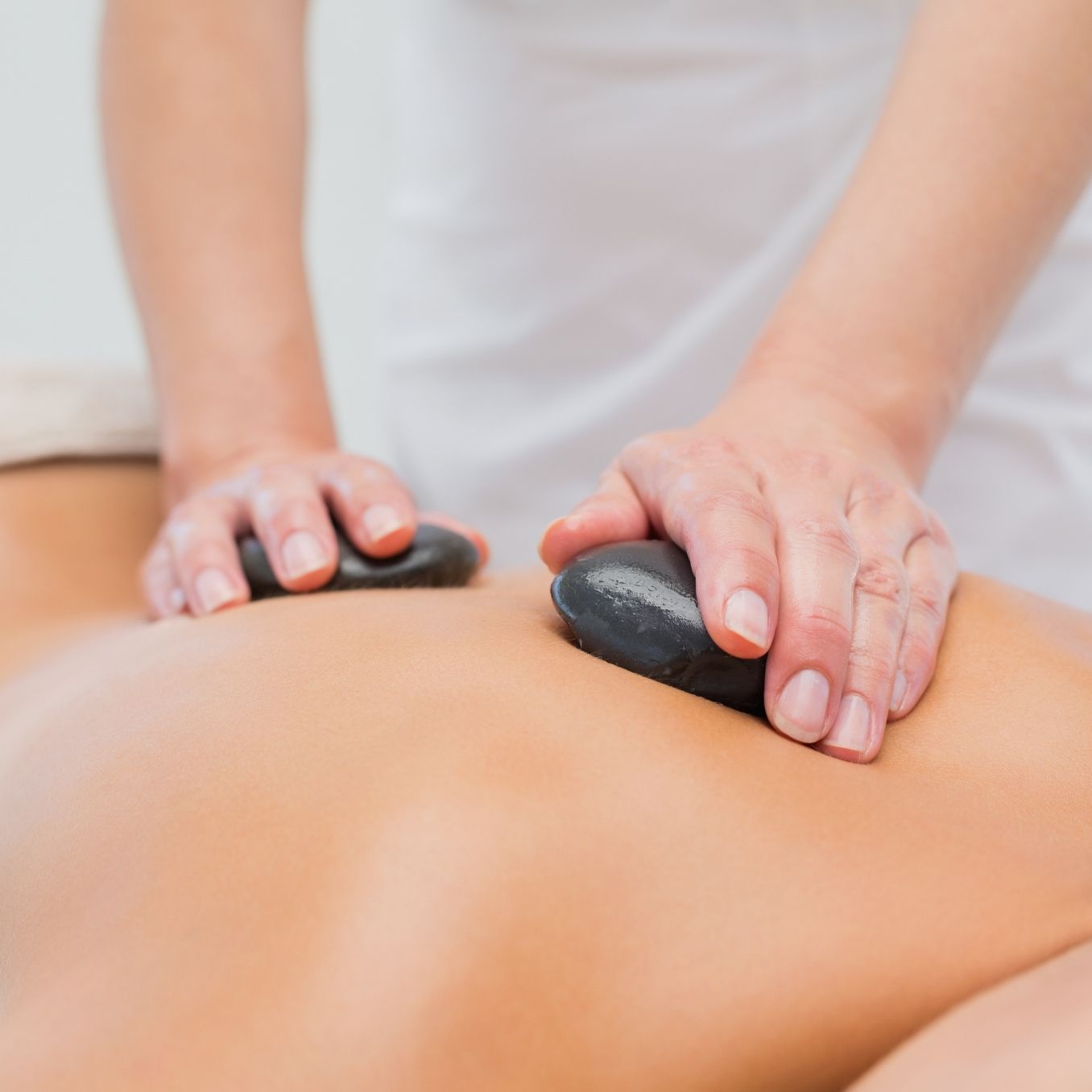 Hot Stone Massage - Holistic Therapies | Josie’s Botanicals